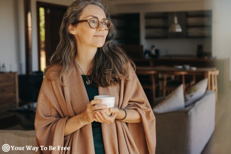 A woman drinking a cup of coffee in the morning showing How to Create a Morning Routine