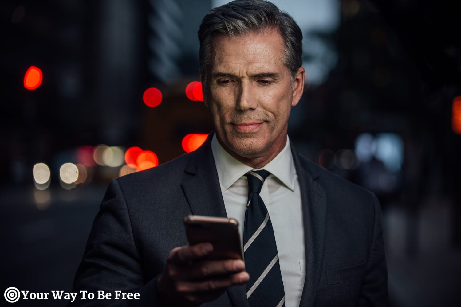 a man looking at his phone in a dark street, representing the Habits of Highly Successful People