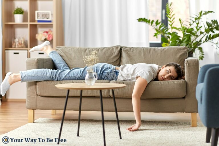 A woman crouching on the sofa representing No Excuse for Laziness- Take Action for a Strong Mind and Body