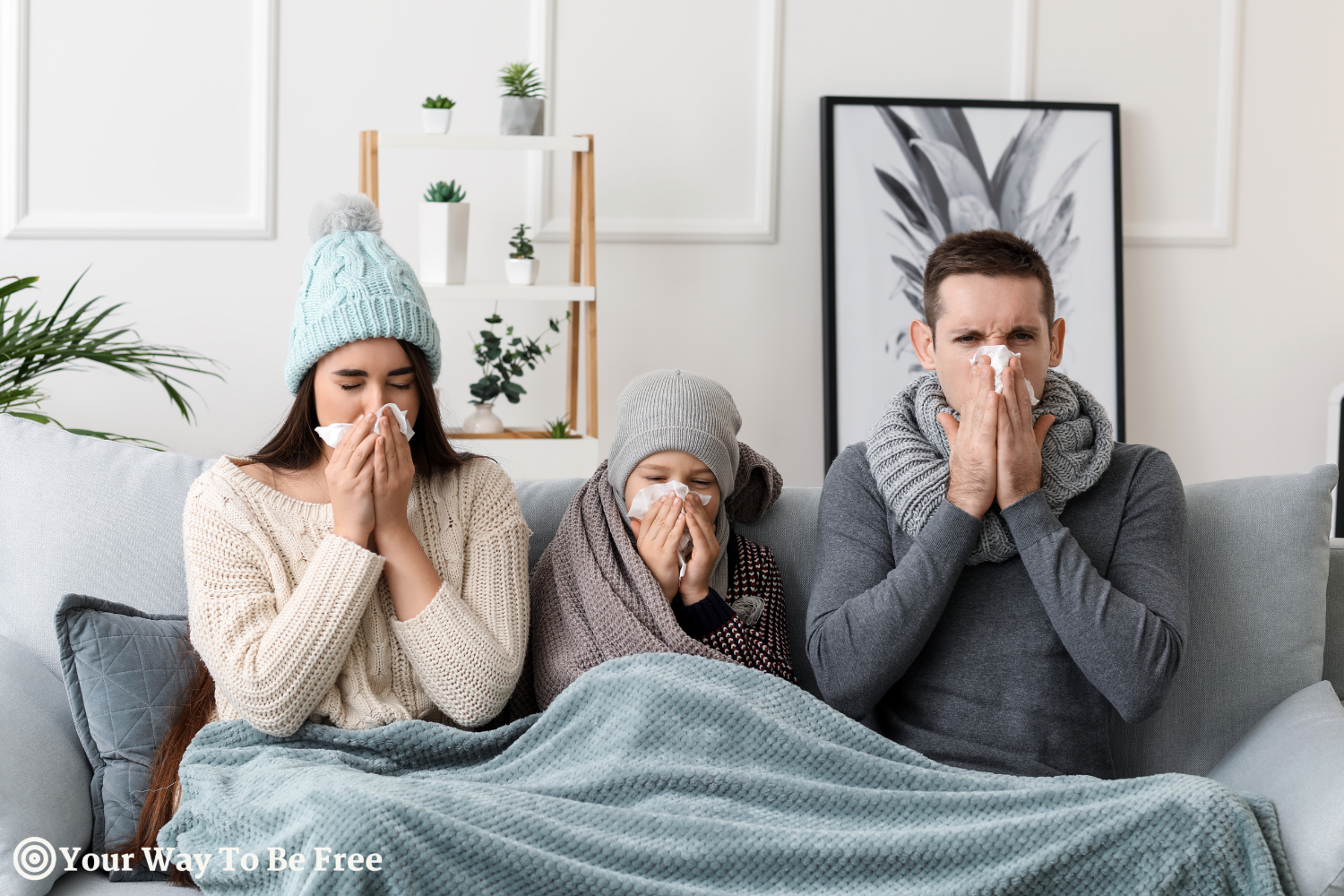 Family sick with flu at home sitting on a couch in winter. they want to be healthy boosting their immune health